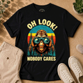 T-Shirt — "Oh Look! Nobody Cares" Retro Binoculars Sasquatch Tee