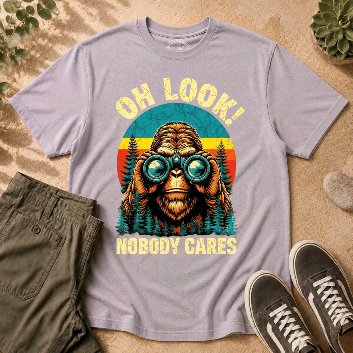 T-Shirt — "Oh Look! Nobody Cares" Retro Binoculars Sasquatch Tee