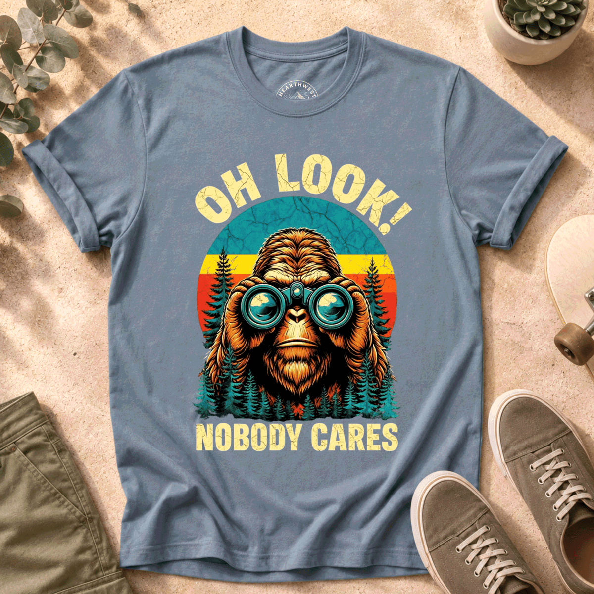 T-Shirt — "Oh Look! Nobody Cares" Retro Binoculars Sasquatch Tee